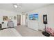 A bedroom that provides a comfortable setting with a desk and TV, and a personal touch at 1240 Bridgewater Walk, Snellville, GA 30078