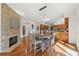 Charming breakfast area with a stone fireplace and views of the kitchen at 1240 Bridgewater Walk, Snellville, GA 30078