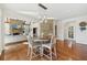 Breakfast area with stone fireplace, hardwood floors, and natural light at 1240 Bridgewater Walk, Snellville, GA 30078
