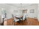 The dining room boasts hardwood floors, a chandelier, and stylish decor at 1240 Bridgewater Walk, Snellville, GA 30078