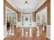 Inviting foyer with hardwood floors and sophisticated trim showcasing the entryway and dining room at 1240 Bridgewater Walk, Snellville, GA 30078