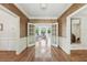 Elegant hallway with hardwood floors, double doors, and views of the sunlit living room at 1240 Bridgewater Walk, Snellville, GA 30078