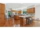 Spacious kitchen with wooden cabinets, granite countertops, and stainless steel appliances at 1240 Bridgewater Walk, Snellville, GA 30078