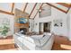 Spacious living room with stone fireplace, wood beams, and ample natural light at 1240 Bridgewater Walk, Snellville, GA 30078