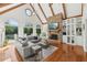Bright and airy living room with high vaulted ceilings, stone fireplace, hardwood floors, and generous windows at 1240 Bridgewater Walk, Snellville, GA 30078