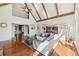 Spacious living room with soaring ceilings, wood beams, and large windows filling the space with natural light at 1240 Bridgewater Walk, Snellville, GA 30078