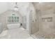Luxurious bathroom with soaking tub, tiled shower, and dual vanities at 1240 Bridgewater Walk, Snellville, GA 30078