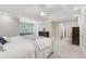 Spacious main bedroom with tray ceilings, ceiling fan, and view to the ensuite at 1240 Bridgewater Walk, Snellville, GA 30078