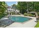 Stunning backyard oasis with a large pool, gazebo, and beautifully landscaped surroundings at 1240 Bridgewater Walk, Snellville, GA 30078