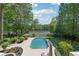 Lush backyard oasis with a pool, gazebo, and beautiful lake views at 1240 Bridgewater Walk, Snellville, GA 30078
