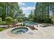 Inviting pool and hot tub area with a spacious patio, perfect for outdoor entertaining at 1240 Bridgewater Walk, Snellville, GA 30078