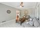 Cozy sunroom with tile floors, ample seating, and plenty of natural light at 1240 Bridgewater Walk, Snellville, GA 30078