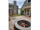Backyard featuring a stone fire pit, brick pavers, and plenty of outdoor entertainment space at 2320 Glynmoore Dr, Lawrenceville, GA 30043