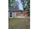 Charming backyard featuring a patio, fire pit, and pergola, perfect for outdoor gatherings at 2320 Glynmoore Dr, Lawrenceville, GA 30043