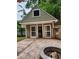 Backyard outdoor building with stone fire pit and brick pavers at 2320 Glynmoore Dr, Lawrenceville, GA 30043