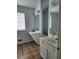 Bathroom with dual vanities, mirrors, and neutral walls at 2320 Glynmoore Dr, Lawrenceville, GA 30043