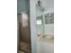Bathroom vanity with neutral countertops and a glass enclosed shower at 2320 Glynmoore Dr, Lawrenceville, GA 30043