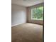Cozy bedroom with a large window offering plenty of natural light at 2320 Glynmoore Dr, Lawrenceville, GA 30043