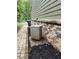 Well-maintained exterior featuring brick accents, landscaping, and modern air conditioning unit at 2320 Glynmoore Dr, Lawrenceville, GA 30043
