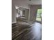Spacious living room featuring hardwood floors, windows, and natural light at 2320 Glynmoore Dr, Lawrenceville, GA 30043