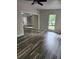 Bright living room with hardwood floors, a ceiling fan, and natural light at 2320 Glynmoore Dr, Lawrenceville, GA 30043