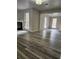 Open floor plan living room with hardwood floors, windows, and natural light at 2320 Glynmoore Dr, Lawrenceville, GA 30043