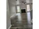 Bright living room featuring hardwood floors, a cozy fireplace, and large windows at 2320 Glynmoore Dr, Lawrenceville, GA 30043