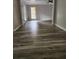 Spacious living room featuring hardwood floors and a ceiling fan at 2320 Glynmoore Dr, Lawrenceville, GA 30043