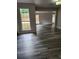 Open-concept living room featuring hardwood floors, fireplace, and natural light at 2320 Glynmoore Dr, Lawrenceville, GA 30043