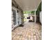 Charming brick patio with an outdoor fireplace/pizza oven and covered area for entertaining at 2320 Glynmoore Dr, Lawrenceville, GA 30043