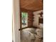 Unfinished storage room with shelving and a view to the outside at 2320 Glynmoore Dr, Lawrenceville, GA 30043