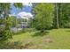 Large backyard with mature trees and ample space for outdoor activities at 2673 Deerfield Sw Cir, Marietta, GA 30064