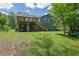 Spacious backyard featuring a well-maintained lawn and mature trees, enhancing privacy at 2673 Deerfield Sw Cir, Marietta, GA 30064