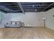 Spacious basement features a modern design with light-colored vinyl floors and open ceiling at 2673 Deerfield Sw Cir, Marietta, GA 30064