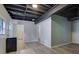 Finished basement featuring an exposed ceiling, ample storage, and wood-look flooring at 2673 Deerfield Sw Cir, Marietta, GA 30064