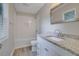 Updated bathroom with granite counters, white cabinets, and a subway tile shower/tub combo at 2673 Deerfield Sw Cir, Marietta, GA 30064