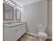 Bright bathroom features double sinks, granite countertops, and plenty of storage space at 2673 Deerfield Sw Cir, Marietta, GA 30064