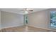 Bright bedroom features wood flooring, ceiling fan, and natural light from large windows at 2673 Deerfield Sw Cir, Marietta, GA 30064