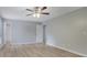 Bright bedroom with wood-look flooring, neutral walls, and ample closet space at 2673 Deerfield Sw Cir, Marietta, GA 30064