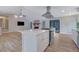 Open concept kitchen with island, stainless steel appliances, and views of the living room at 2673 Deerfield Sw Cir, Marietta, GA 30064