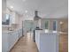 Modern kitchen with white cabinets, stainless steel appliances, and open to living area at 2673 Deerfield Sw Cir, Marietta, GA 30064