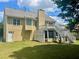 Back exterior view of the home featuring a deck, screened in patio, yard and traditional siding at 775 Brand South Trl, Lawrenceville, GA 30046