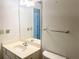 Plain bathroom, showing a sink with a white vanity and a mirror that reflects the entry to another room at 775 Brand South Trl, Lawrenceville, GA 30046
