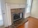 Close-up of the stone fireplace featuring a white mantle and views to the exterior at 775 Brand South Trl, Lawrenceville, GA 30046