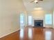 Spacious living room with vaulted ceiling, stone fireplace, and hardwood floors at 775 Brand South Trl, Lawrenceville, GA 30046