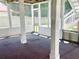 Enclosed patio with screen and wooden support beams giving access to the backyard with staircase at 775 Brand South Trl, Lawrenceville, GA 30046