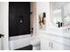 Contemporary bathroom with sleek black tile, modern fixtures, and vanity at 104 Meldon Ave, Atlanta, GA 30315