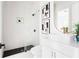 Stylish bathroom with a frameless shower, modern vanity, and striking black and white decor at 104 Meldon Ave, Atlanta, GA 30315