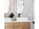 Modern bathroom featuring dual sinks, light wood cabinets, gold-trimmed mirrors, and square sinks at 104 Meldon Ave, Atlanta, GA 30315