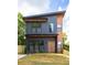 Modern two-story home showcasing a sleek exterior design and a well-manicured lawn at 104 Meldon Ave, Atlanta, GA 30315